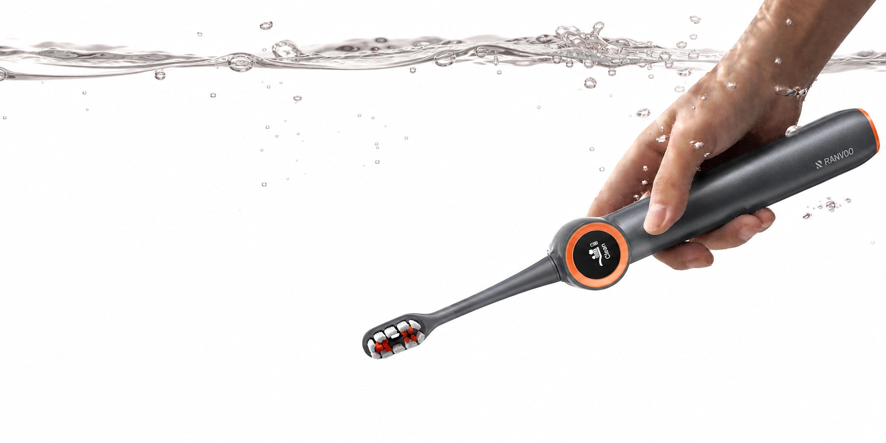 A hand holding an AirJet X3 and dive into water.