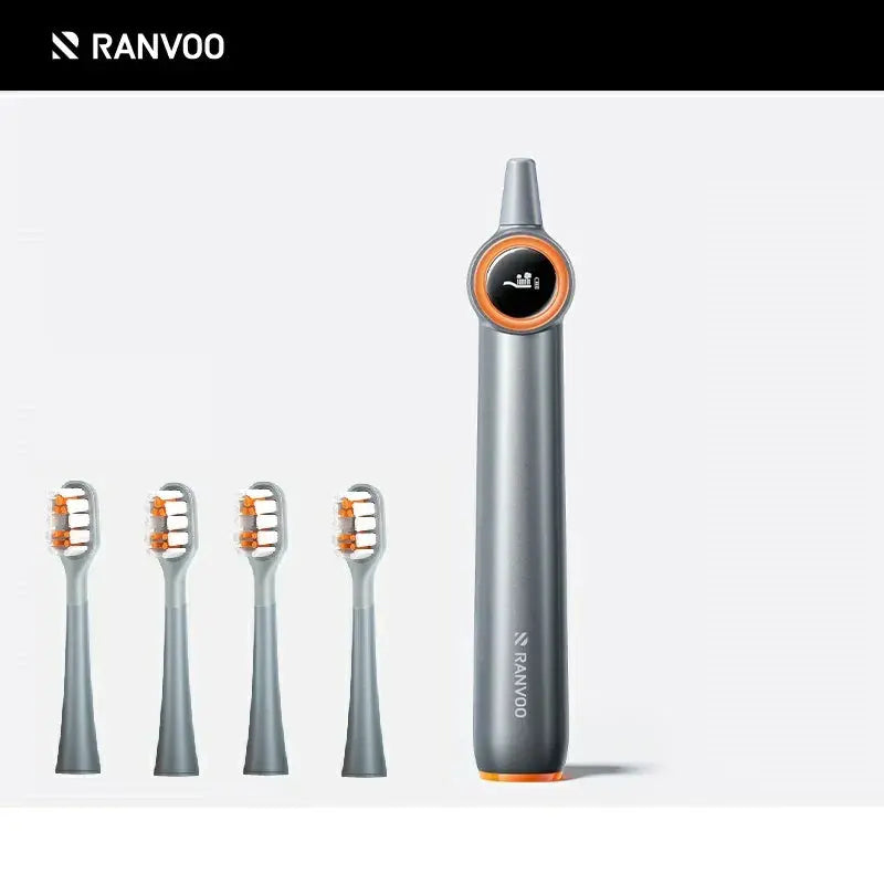 Two electric toothbrushes with gray bodies and orange detailing. One has a blue brush head and the other has a white brush head.
